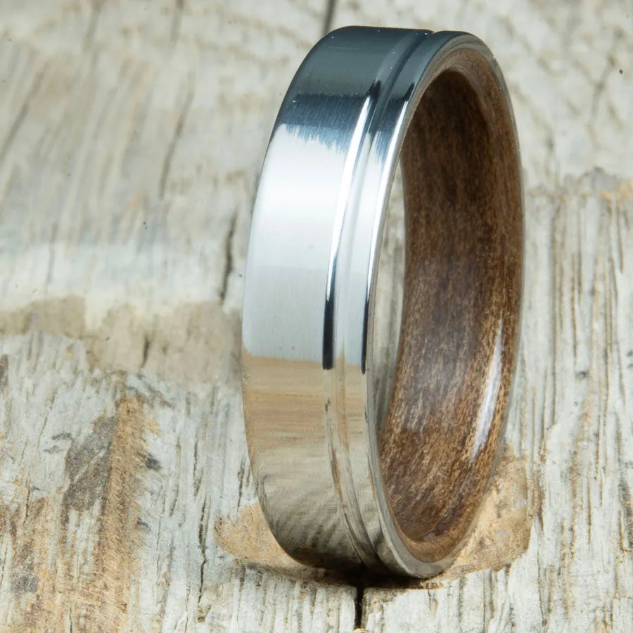 Polished titanium wedding band with Walnut interior