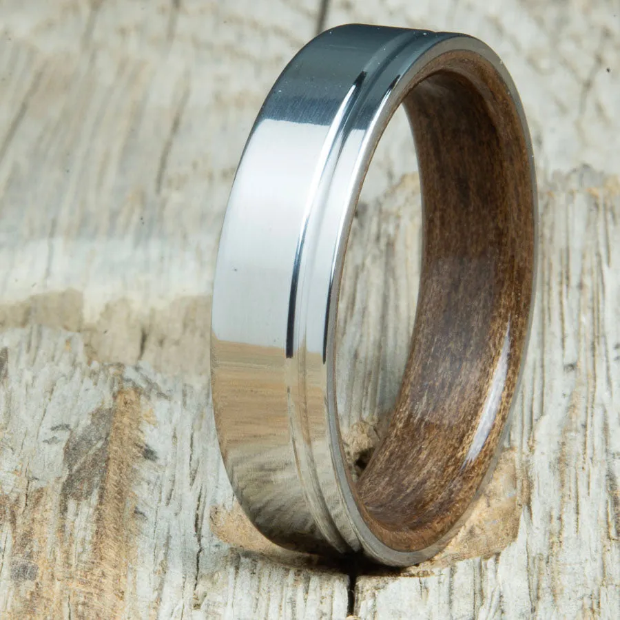 Polished titanium wedding band with Walnut interior