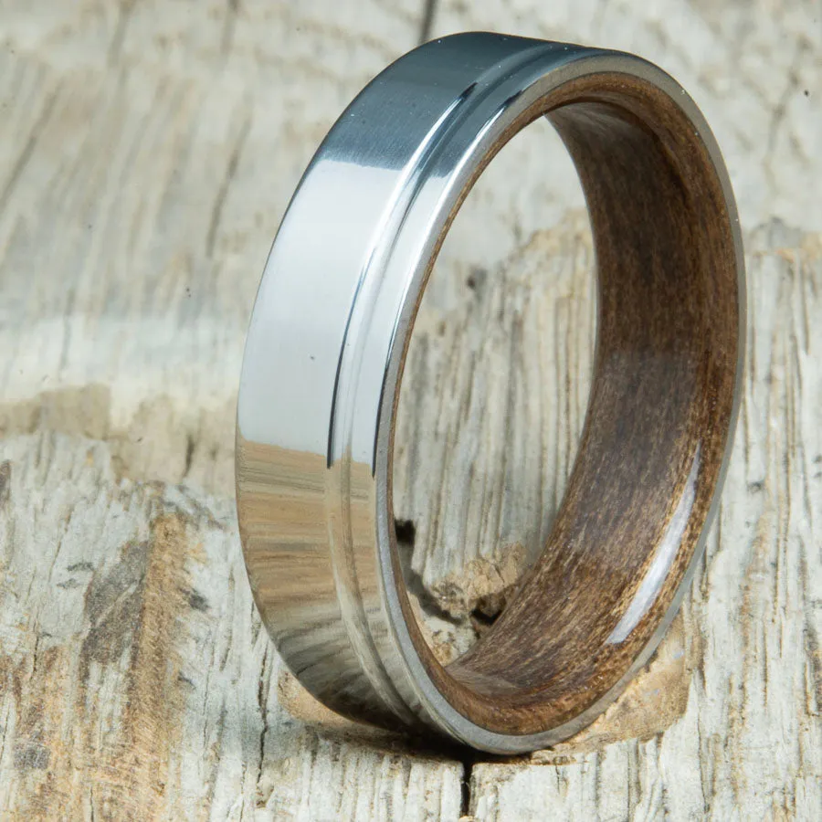 Polished titanium wedding band with Walnut interior