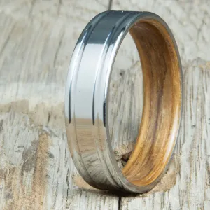 Titanium wedding band with Whiskey barrel interior