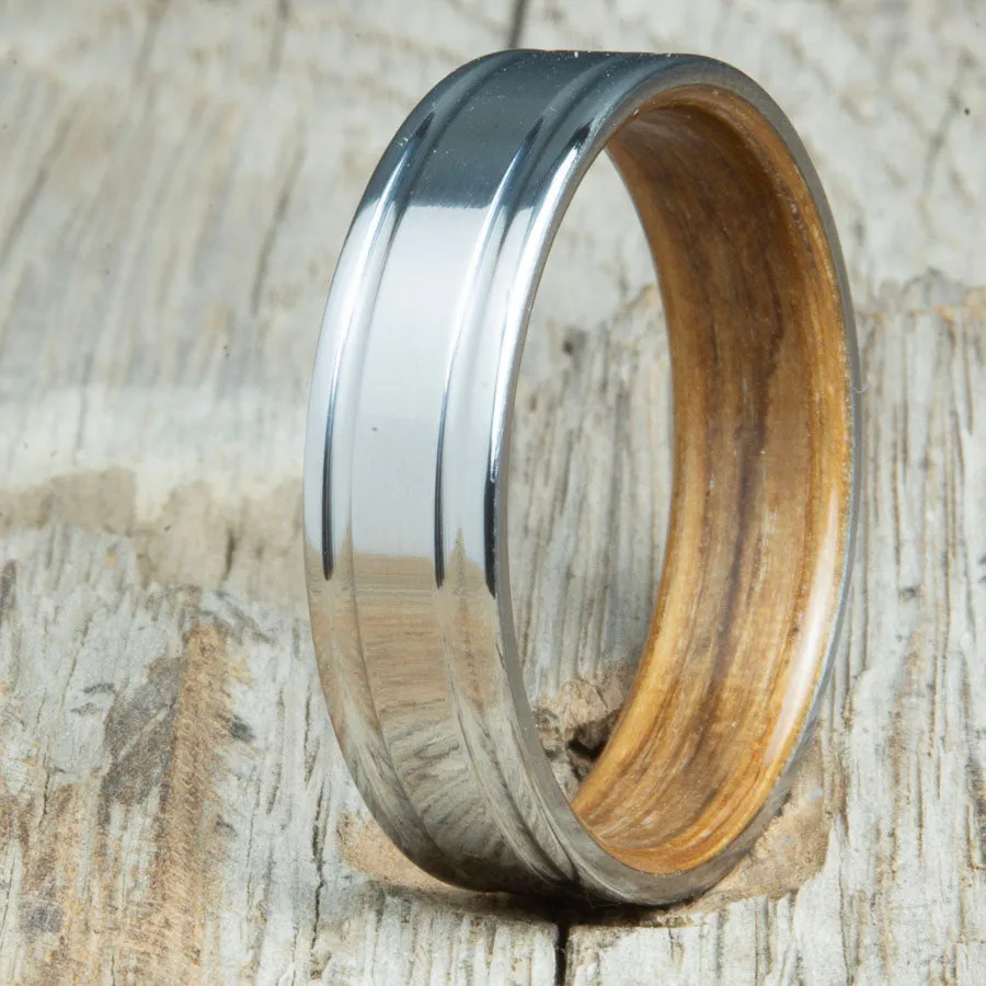Titanium wedding band with Whiskey barrel interior